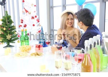 A young Asian couple is celebrating the New Year.