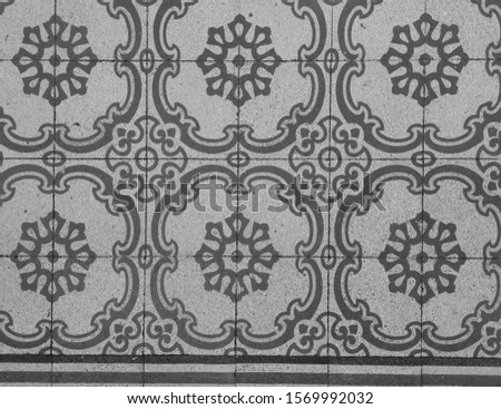 Decorative vintage tile pattern on the floor.