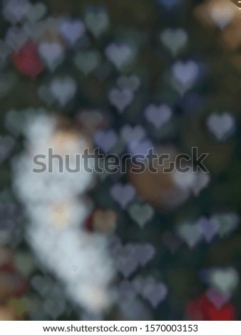 Blurred image white heart shape of bokeh for Valentine or lovely background concept.
