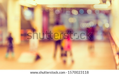 Vintage tone abstract blur image of Kids playing skate or rollerblades in skating rink with bokeh for background usage .