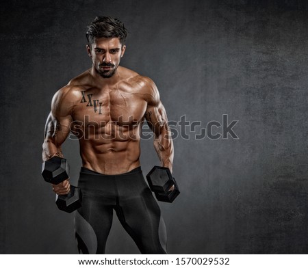 Handsome Muscular Men Lifting Weights Royalty-Free Stock Photo #1570029532