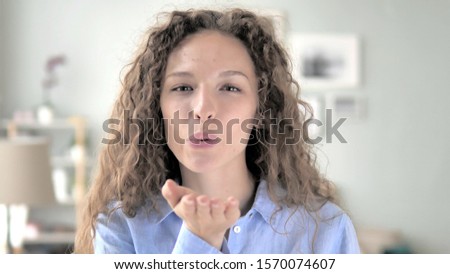 Flying Kiss by Curly Hair Woman in Love