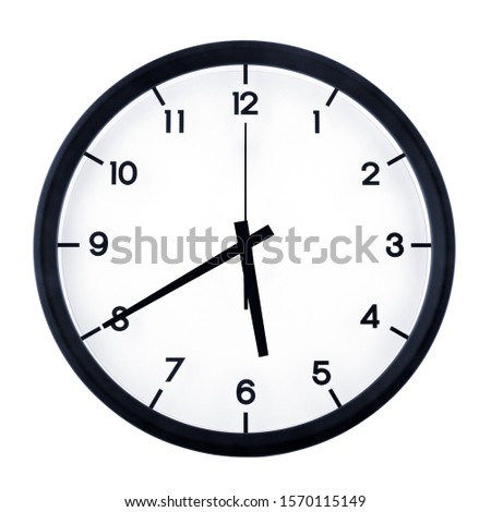 Classic analog clock pointing at five forty, isolated on white background.