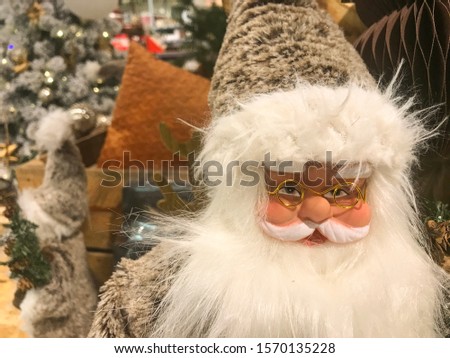 Toy Santa Claus figure in close up at traditional Christmas fair.