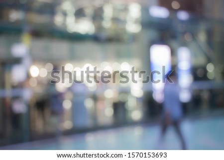 Blurred bokeh men background image of department store entrance for people backdrop usage concept.