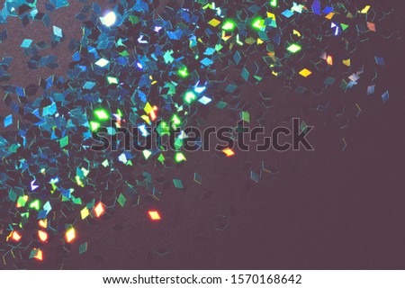 Textured background with blue glitter sparkle on black in vintage colors