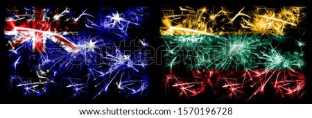 Australia, Ozzie vs Lithuania, Lithuanian New Year celebration sparkling fireworks flags concept background. Combination of two abstract states flags.
