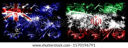 Australia, Ozzie vs Iran, Iranian New Year celebration sparkling fireworks flags concept background. Combination of two abstract states flags.
