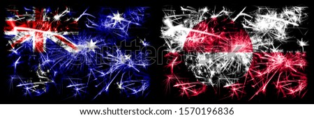 Australia, Ozzie vs Greenland New Year celebration sparkling fireworks flags concept background. Combination of two abstract states flags.
