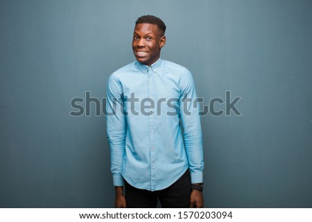 young african american black man looking worried, stressed, anxious and scared, panicking and clenching teeth