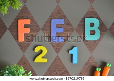 February 21, Birthday for kids with wooden text design for background.