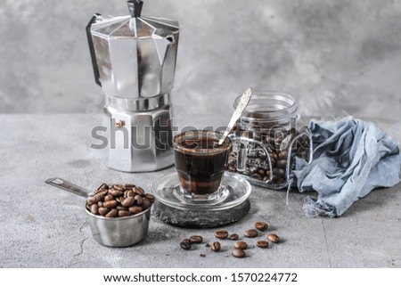 Photo of Coffee bean cookies with espresso coffee. Gray backgrou