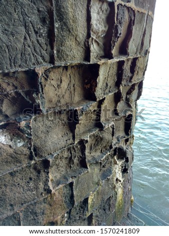 Erosion Of Fort Rock Due To Sea Tides But The Binding Material Of It Remains The Same Till Date