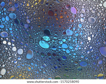 Abstract multicolor water oil soap bubbles mixed texture. Colorful 
background. Close-up shot. Rainbow oil pattern and texture