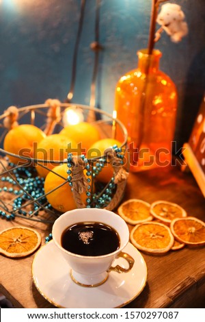 Christmas background. Clean blank, coffee, christmas decorations, coffee, citruses and light background. Cozy xmas room decor. Flat lay, cope space 


