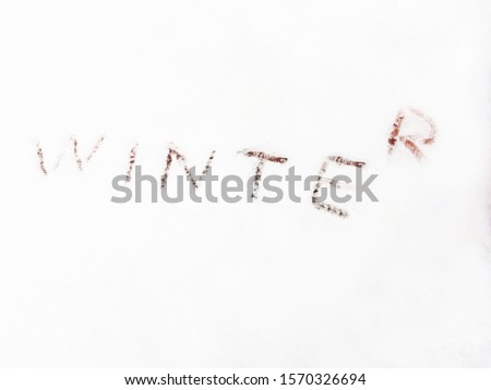 The inscription Winter in the snow