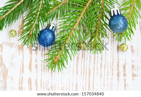 Christmas border with pine tree on a wooden background
