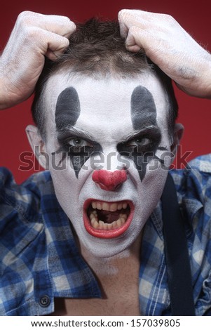 Evil Spooky Clown Portrait on Red Background