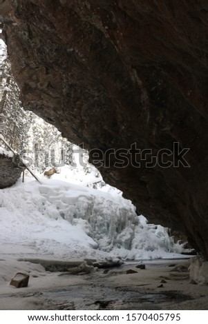 Large Cave at Johnston's canyon. beautiful river running in the cave. great quality picture.