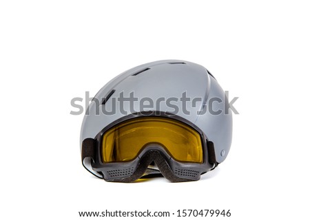 Ski helmet ski goggles isolated on white background. The concept of skiing, proper clothing and preparation for winter sports.