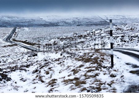 snow covered landscape with a road running through the picture. Near Stanhope County Durham