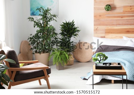 Miniature zen garden in stylish bedroom interior Royalty-Free Stock Photo #1570515172
