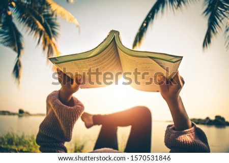 Women read book in the holiday in quiet nature, Concept reading a book.
