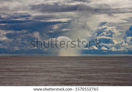 Raincloud near Balaio, Amazon River, Brazil Royalty-Free Stock Photo #1570552765