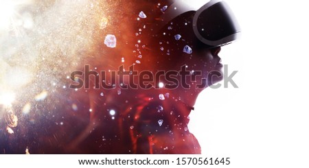 Double exposure of female face on white background. Abstract woman portrait. Digital art. Girl in glasses of virtual reality. Augmented reality, dream, future technology, game concept. Fire flares.