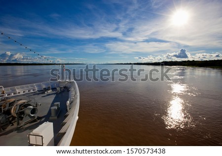 View from Ship over Amazon River with the sun reflecting in water, near Panelas, Brazil