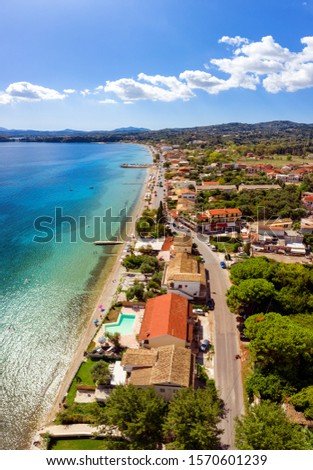 Aerial of mediterranean shore village in Greece. Dassia resort on Corfu island. Beautiful village in summer