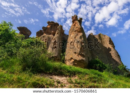Historical ancient Frig (Phrygia, Gordion) Valley. Monuments, structures, carved into rocks. Frig Valley is popular tourist attraction in the Yazilikaya, Afyon. / Turkey. Royalty-Free Stock Photo #1570606861