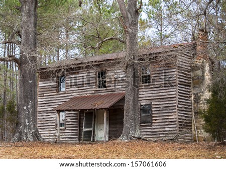 A discarded old  home in the woods Royalty-Free Stock Photo #157061606