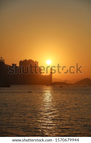 Beautiful colorful sunset in sulpur cannel ,hong kong city skyline. With sea and ocean bay