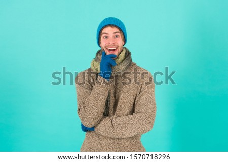 When weather turns chilly. Happy man in winter style blue background. Handsome guy in casual comfy style. Winter fashion and accessories. Keep warm in style. Maintaining your style is easy.