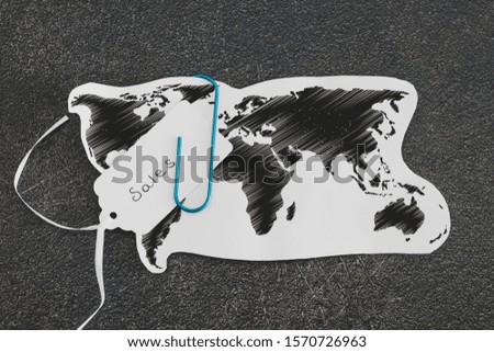 business going global conceptual still-life, world map with Sales price tag clipped to it