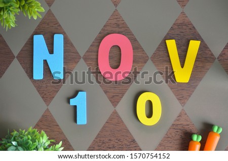 November 10, Birthday for kids with wooden text design for background.