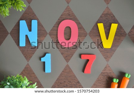 November 17, Birthday for kids with wooden text design for background.