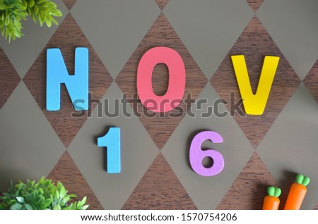 November 16, Birthday for kids with wooden text design for background.