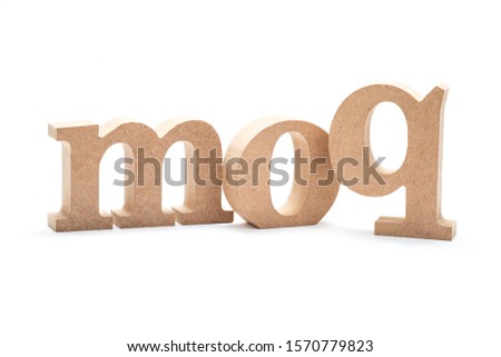 MOQ acronym (Minimum Order Quantity) by wood alphabets isolated on white background