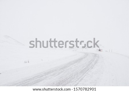 snow mountain and road covered with white snow 