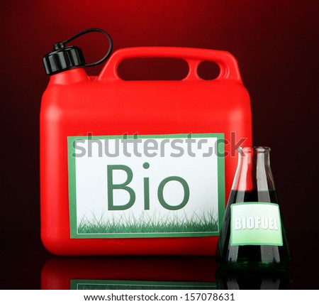 Bio fuels in canister on red background