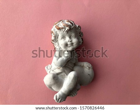 little angel on a pink background