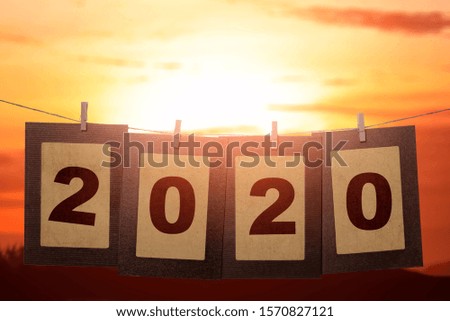 2020 on the cardboard hanging with rope. Happy New Year 2020