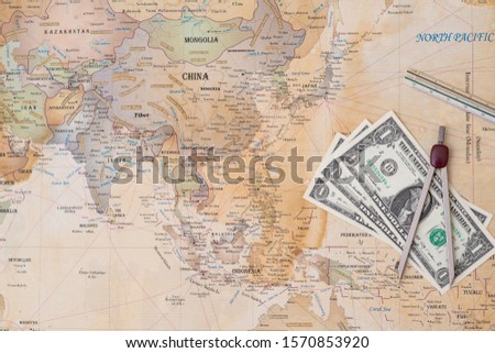Money and angle on the map of the world.
