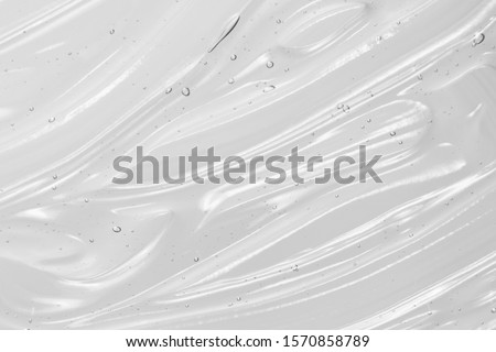 Serum texture, clear liquid gel background. Transparent beauty skincare product sample Royalty-Free Stock Photo #1570858789