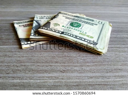 Cash Dollars money on wood background with copy space