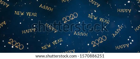 Beautiful Holiday background Happy New Year 2020. Wide Angle Creative Collage of sparkling Golden words Happy New Year 2020 scattered on Blue background. Panoramic header for website. Mixed media.