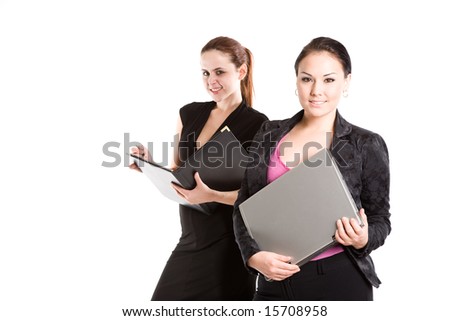 An isolated shot of two businesswomen working together