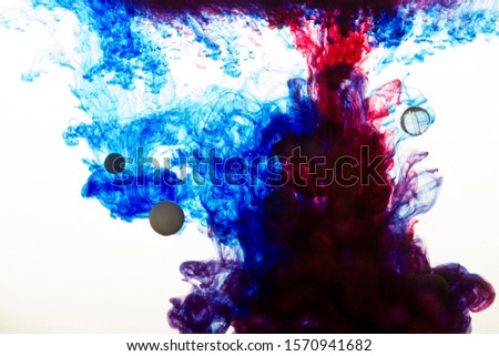 red and blue inks dissolve in water
